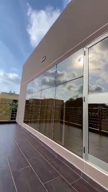 Modern building terrace reflected in glass