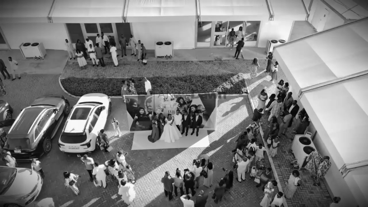 Aerial black-and-white frame from a wedding film